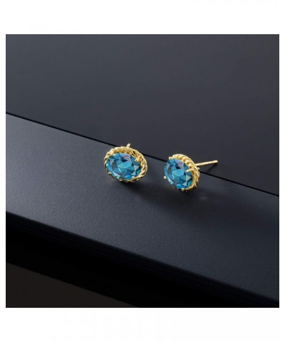 14K Yellow Gold London Blue Topaz Stud Earrings For Women (2.60 Cttw, Gemstone Birthstone Oval 8X6MM) $91.80 Earrings